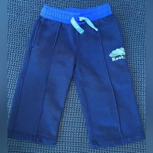 Roots kids size 4T capris with pockets in dark blue with purple waist band